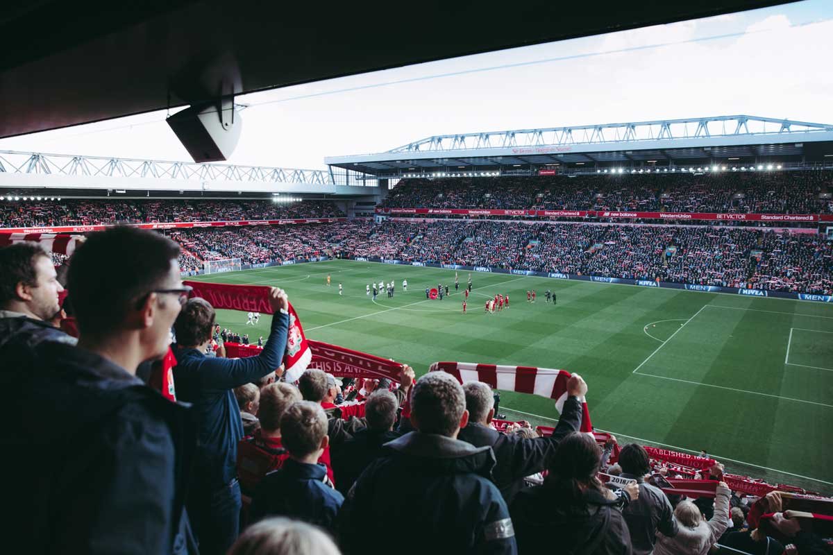 Fans raising the banner high after Liverpool wins 2-0 against Totten ham FC